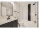 Modern bathroom with black and white tile and updated vanity at 8160 S Fillmore Cir, Centennial, CO 80122