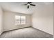 Spacious bedroom with neutral wall paint and carpeted floors at 8160 S Fillmore Cir, Centennial, CO 80122