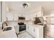 Modern kitchen featuring white cabinets, stainless steel appliances, and hexagon tile flooring at 8160 S Fillmore Cir, Centennial, CO 80122