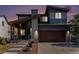 Charming two-story home featuring a covered front porch and a two-car garage at 10796 Truckee Cir, Commerce City, CO 80022