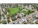 Aerial shot capturing a serene neighborhood with lush trees, a green park, and well-maintained homes at 1115 W Quincy Ave, Englewood, CO 80110