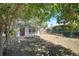 Backyard featuring a small lawn, chain link fence and mature trees at 1115 W Quincy Ave, Englewood, CO 80110