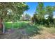 View of backyard featuring a gated entry to a grassy lot at 1115 W Quincy Ave, Englewood, CO 80110