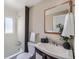 Well-lit bathroom with a shower/tub combo and a modern sink at 1115 W Quincy Ave, Englewood, CO 80110