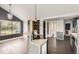 Open kitchen area with an island and stainless steel appliances at 1115 W Quincy Ave, Englewood, CO 80110