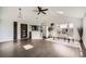 Bright living room features hardwood floors, vaulted ceilings, and skylights at 1115 W Quincy Ave, Englewood, CO 80110