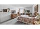 Cozy bedroom featuring a floral bedspread, dresser, and natural light, offering a tranquil retreat at 13902 E Marina Dr # 303, Aurora, CO 80014