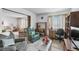 Comfortable living space with plush seating, a desk area, and abundant natural light at 13902 E Marina Dr # 303, Aurora, CO 80014