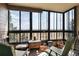 The sunroom offers serene views, comfortable seating, and an abundance of natural light at 13902 E Marina Dr # 303, Aurora, CO 80014