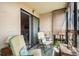 Relaxing sunroom with comfortable seating and sliding glass doors to the home at 13902 E Marina Dr # 303, Aurora, CO 80014
