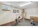 Basement exercise area featuring various fitness machines and neutral carpet at 7681 S Jellison St, Littleton, CO 80127