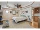 Comfortable bedroom with a ceiling fan, octagonal window and decorative trim at 7681 S Jellison St, Littleton, CO 80127
