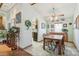 Charming dining area seamlessly connected to the living spaces, featuring classic decor and soft lighting at 7681 S Jellison St, Littleton, CO 80127