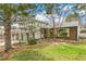 Charming two-story home with brick accents, green trim, well-kept lawn, and two car garage at 7681 S Jellison St, Littleton, CO 80127