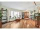 Bright living room featuring hardwood floors, a large window seat, and a welcoming atmosphere at 7681 S Jellison St, Littleton, CO 80127