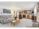 Relaxing living room with a fireplace providing a focal point for gatherings at 7681 S Jellison St, Littleton, CO 80127