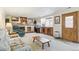 Cozy living room featuring a fireplace and built-in cabinets and shelves at 7681 S Jellison St, Littleton, CO 80127