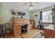 Bright office space with a large desk, two monitors, and comfortable chairs at 7681 S Jellison St, Littleton, CO 80127