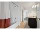 Bathroom featuring a shower/tub combo and vanity with a sink at 20888 E 51St Pl, Denver, CO 80249