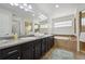 Bathroom features double sinks, a soaking tub, a walk-in shower, and stylish tile work at 20888 E 51St Pl, Denver, CO 80249