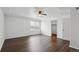This is a bedroom with a large window and dark wood flooring at 20888 E 51St Pl, Denver, CO 80249