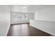 Bonus room with wood floor and large windows with natural light at 20888 E 51St Pl, Denver, CO 80249