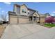 Charming two-story home with a three-car garage and stone-accented facade at 20888 E 51St Pl, Denver, CO 80249