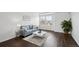 Comfortable living room with a sofa, stylish decor, and plenty of natural light at 20888 E 51St Pl, Denver, CO 80249