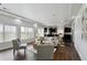Bright and open living area with modern furnishings and views into the kitchen at 20888 E 51St Pl, Denver, CO 80249