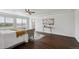 Bright main bedroom features dark wood floor, a large window, and decorative elements at 20888 E 51St Pl, Denver, CO 80249