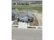 Aerial view of a well-maintained home near a golf course, featuring a three-car garage and modern design at 16218 E 111Th Pl, Commerce City, CO 80022