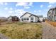 Spacious backyard featuring a well-maintained lawn, ideal for outdoor activities and relaxation at 16218 E 111Th Pl, Commerce City, CO 80022