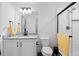 Bright modern bathroom featuring a granite vanity, shower, and a stylish mirror at 16218 E 111Th Pl, Commerce City, CO 80022