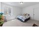 Bright bedroom with large window and carpeted floors at 16218 E 111Th Pl, Commerce City, CO 80022
