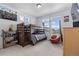 Bright bedroom with bunk beds, large windows, and carpeted floor at 16218 E 111Th Pl, Commerce City, CO 80022