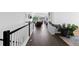 Hallway leading to an open floor plan with dark wood floors and bright natural light at 16218 E 111Th Pl, Commerce City, CO 80022