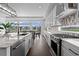 Bright kitchen featuring granite counters, stainless steel appliances, backsplash and hardwood floors at 16218 E 111Th Pl, Commerce City, CO 80022