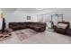Spacious finished basement featuring a large sectional sofa, and carpet at 16218 E 111Th Pl, Commerce City, CO 80022