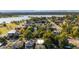Aerial neighborhood view with a lake and mature trees in a scenic, desirable community at 2034 Newton St, Denver, CO 80211