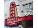 Alamo Draft House Cinema features a retro neon sign and architecture, providing a classic moviegoing experience at 2034 Newton St, Denver, CO 80211