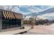 Charming store front with a striped awning and inviting outdoor seating at 2034 Newton St, Denver, CO 80211