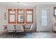 Dining room with modern lighting, light-colored walls, and wood-trimmed windows at 2034 Newton St, Denver, CO 80211
