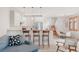Modern kitchen featuring a breakfast bar, stainless steel appliances, and open design at 2034 Newton St, Denver, CO 80211