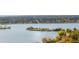 Scenic lake view with an island surrounded by trees and clear blue water at 2034 Newton St, Denver, CO 80211