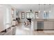 Bright, open-concept living room with wood floors and many large windows at 2034 Newton St, Denver, CO 80211