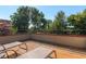 Spacious rooftop deck with lounge chairs and views of the surrounding greenery at 2034 Newton St, Denver, CO 80211