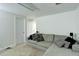 Cozy living room features neutral carpeting and a comfortable sectional sofa at 15099 E Wagontrail Pl, Aurora, CO 80015