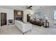 Open-concept living room with brick fireplace, cabinet, large windows, and comfortable seating at 15099 E Wagontrail Pl, Aurora, CO 80015