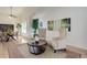 Bright living room featuring vaulted ceilings, light hardwood floors, and a neutral color palette with area rug at 15099 E Wagontrail Pl, Aurora, CO 80015