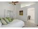 Spacious main bedroom with bright airy feel, ceiling fan, adjoining bathroom, and walk-in closet at 15099 E Wagontrail Pl, Aurora, CO 80015